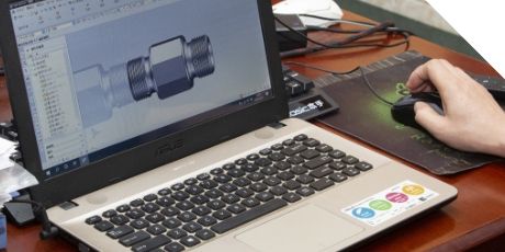 An engineering is drawing the rubber hydraulic adaptor.