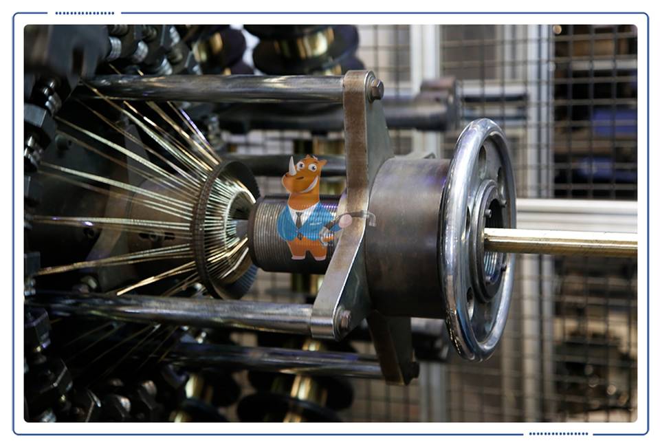 The machine is performing the winding process.