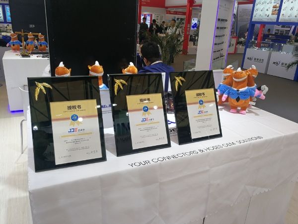 The mascot of DME&JDE is standing in the exhibition hall.