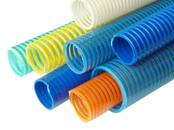 Several different colors of C type PVC suction hoses on white background.