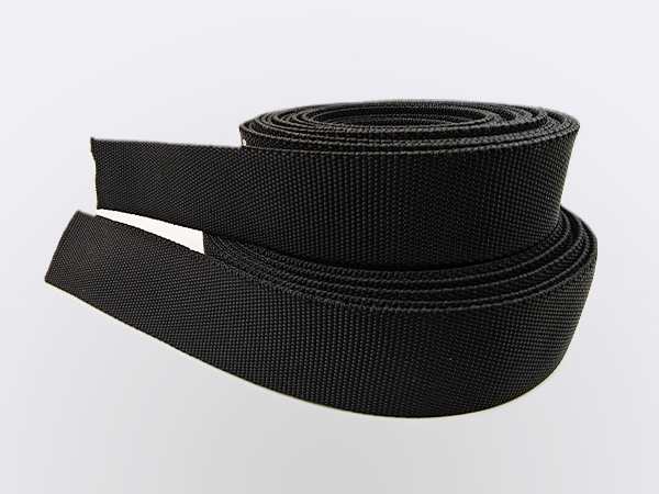 Two rolls of shield-flex hydraulic hose nylon sleeve with company brand.